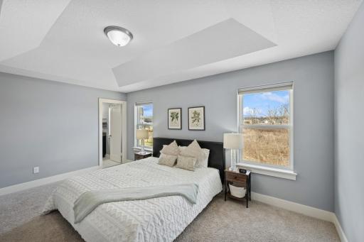 The primary bedroom is bright and airy and extremely private!