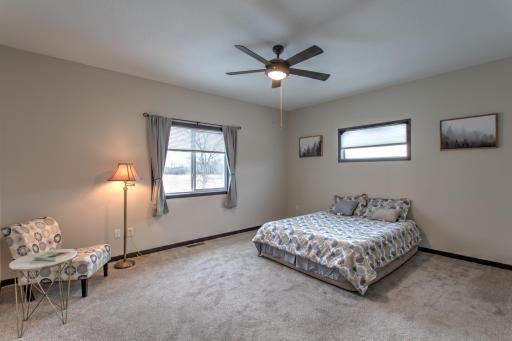 large primary bedroom with a beautiful view