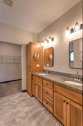 with double sinks and large walk in closet