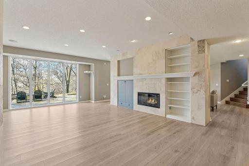 second living space /game room with sunny access to private patio