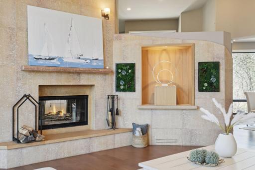 stone features flank the fireplace and entry wall