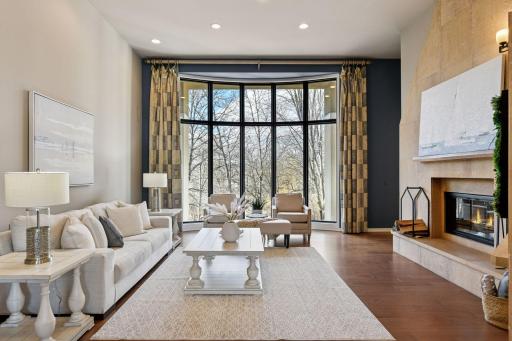 Walls of windows and high vaulted ceilings invite nature inside