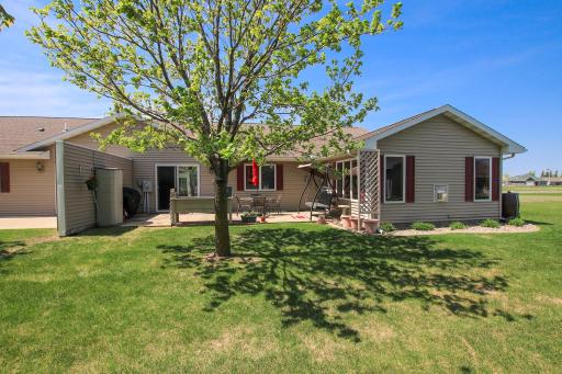 The backyard features an 11'x27' foot concrete patio.