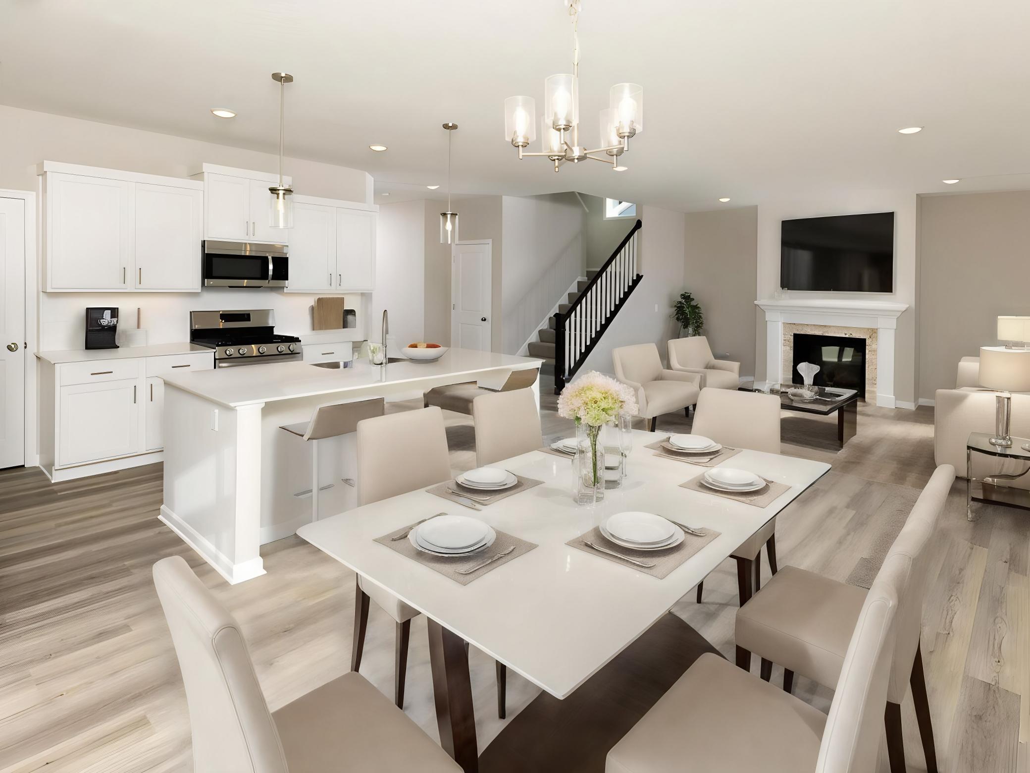 PHOTO OF A DIFFERENT HOME WITH SIMILAR PLAN & FINISHES VIRTUALLY STAGED. Dining, kitchen, & great room feature LVP flooring. Photo may not depict actual plan, materials, & finishes.