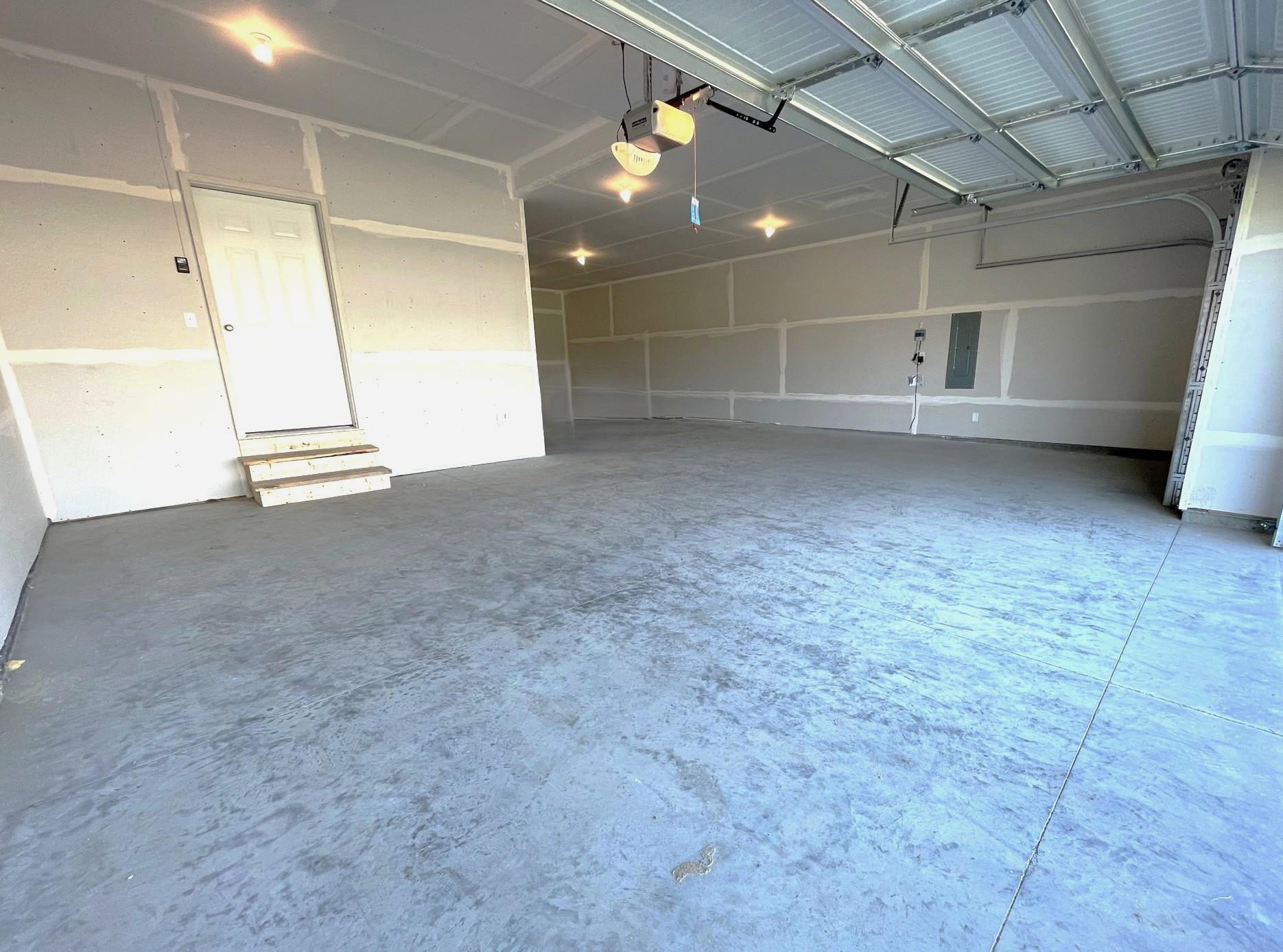 PHOTO OF A DIFFERENT HOME WITH SIMILAR PLAN & FINISHES. 4 BAY GARAGE OFFERS 1,010 SQ.FT. Photo may not depict actual plan, materials, & finishes.