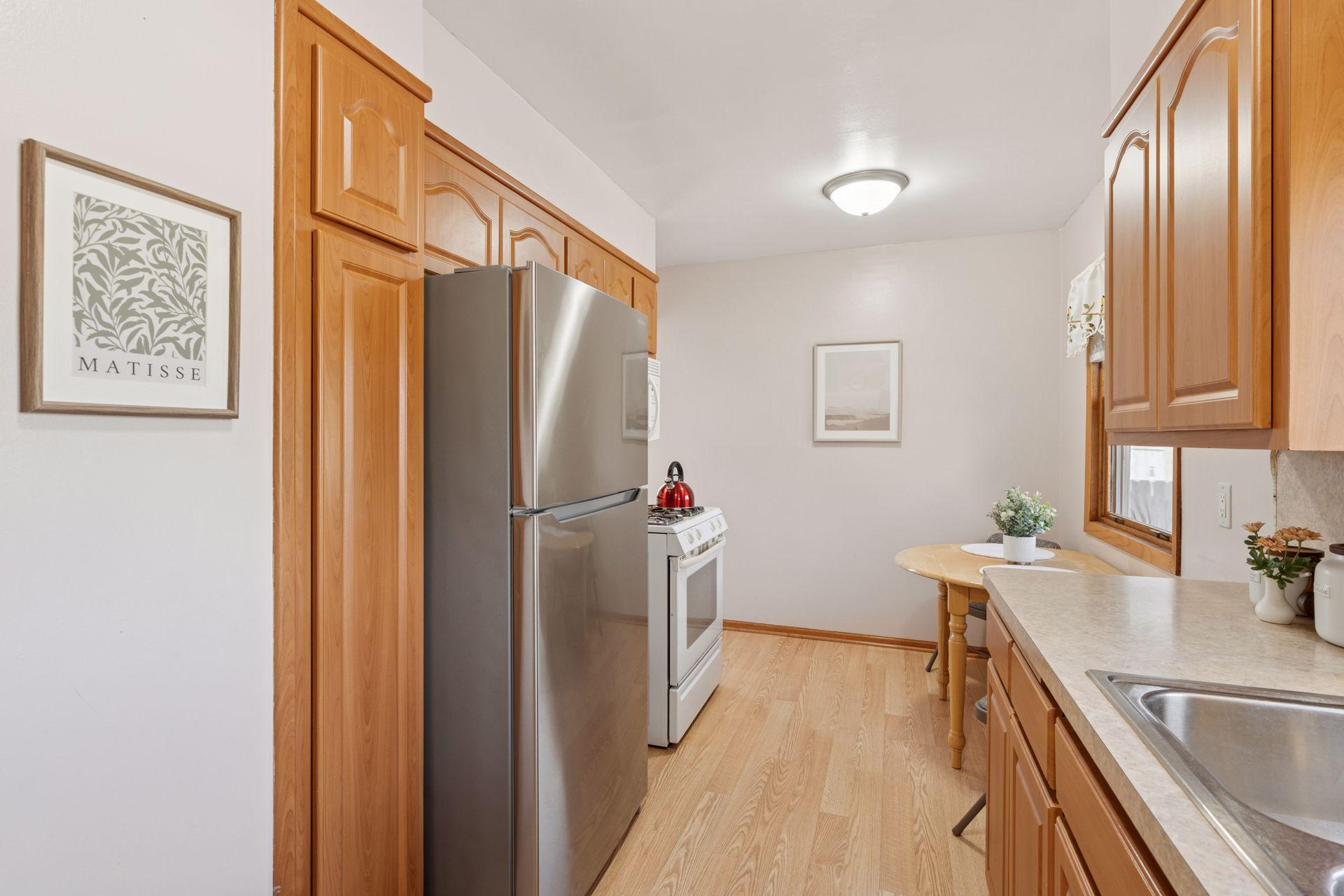 Kitchen overlooks the backyard, new stainless-steel refrigerator