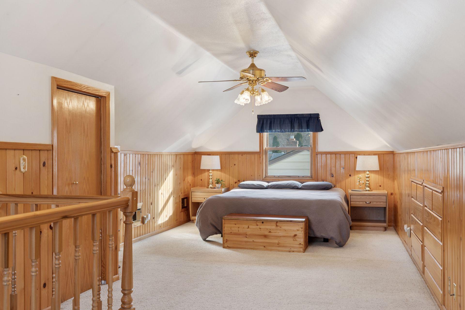 Expansive upper-level bedroom with generous closets, storage and built-ins