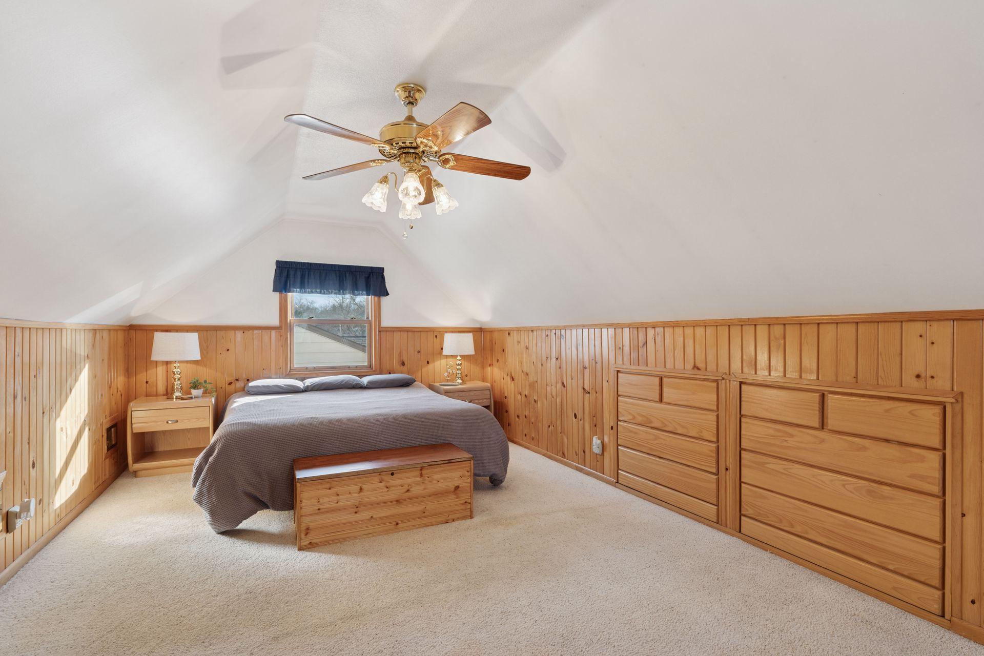 Expansive upper-level bedroom with generous closets, storage and built-ins