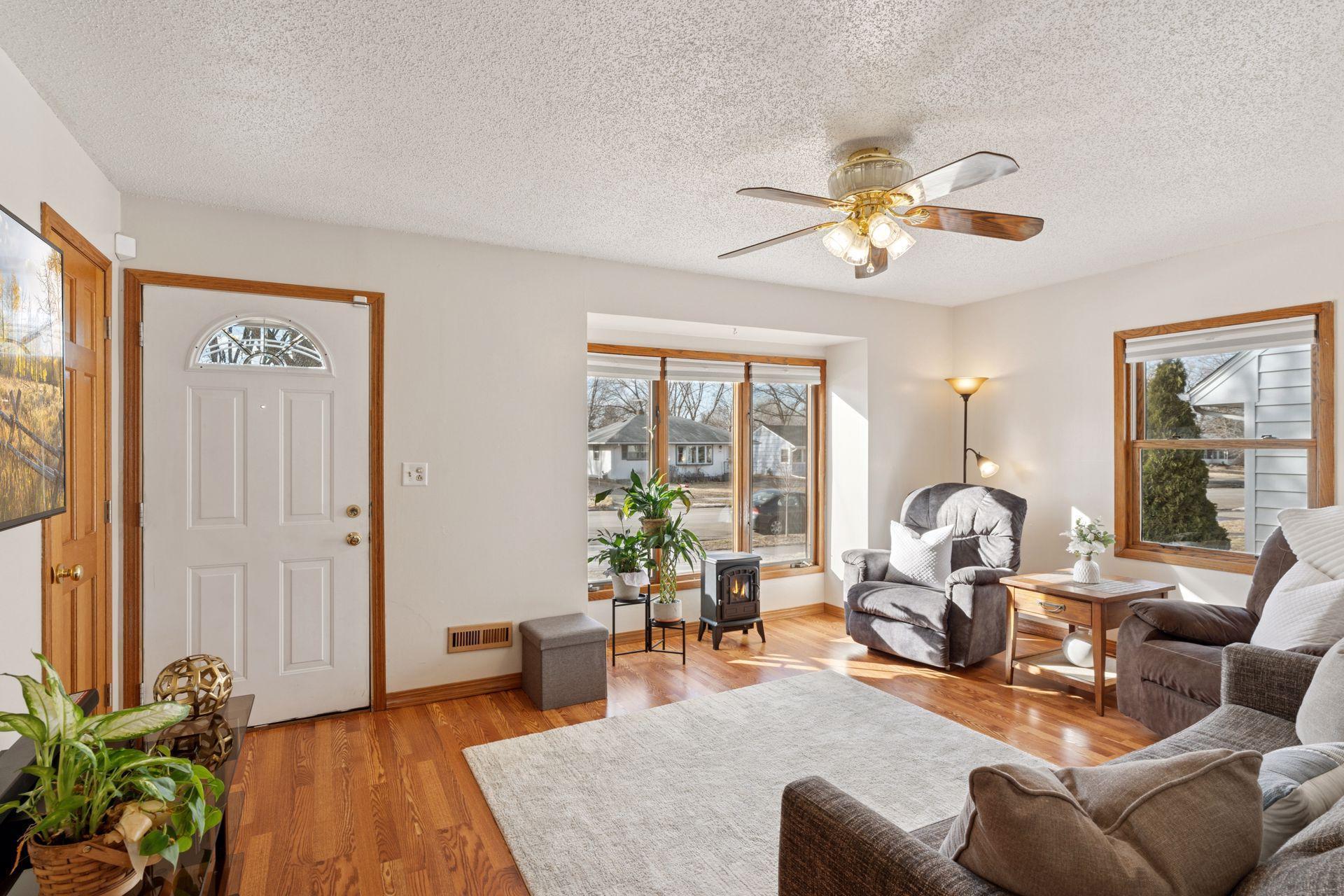 Light and bright living room with new wood plank flooring