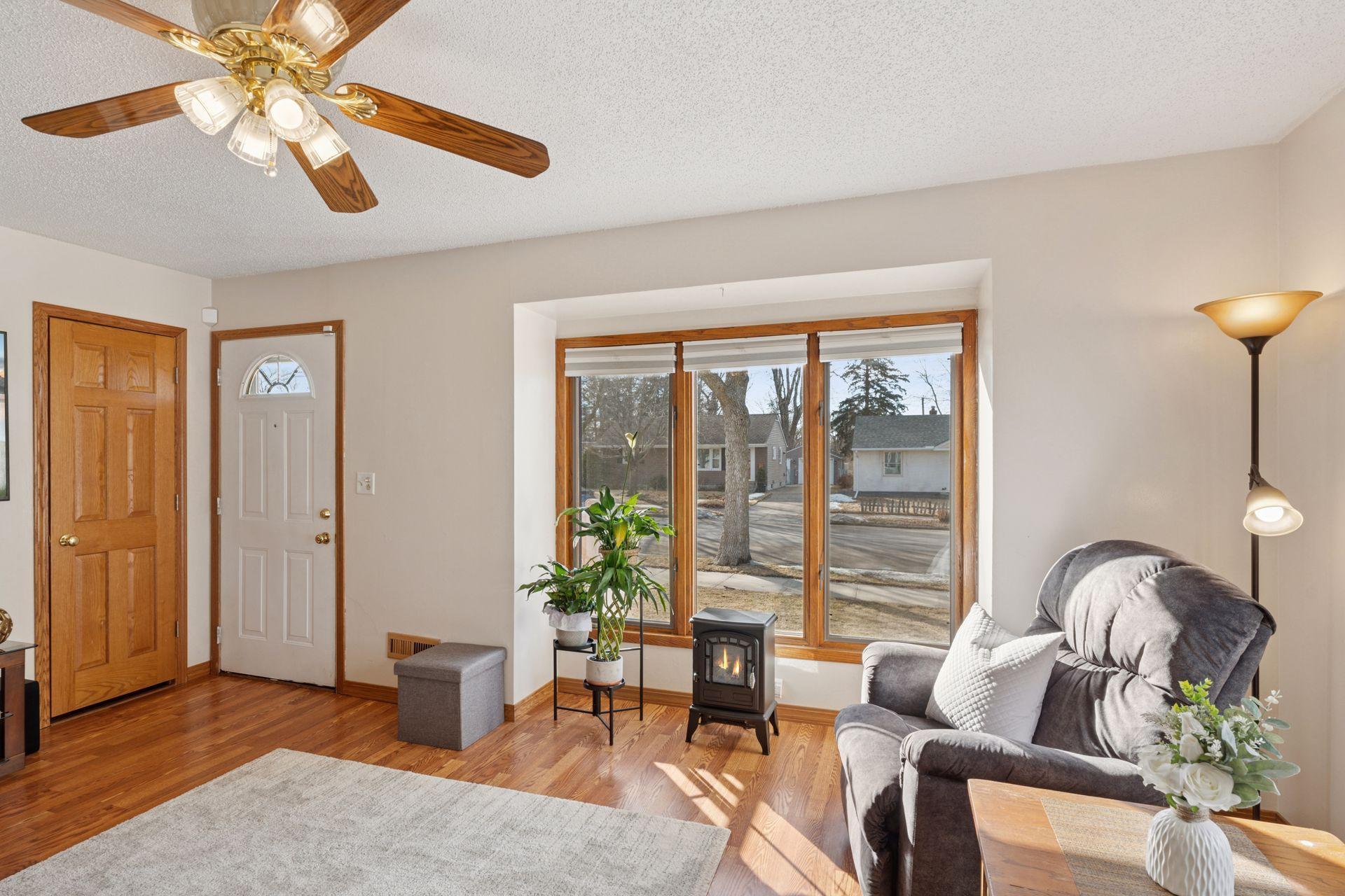 Light and bright living room with new wood plank flooring