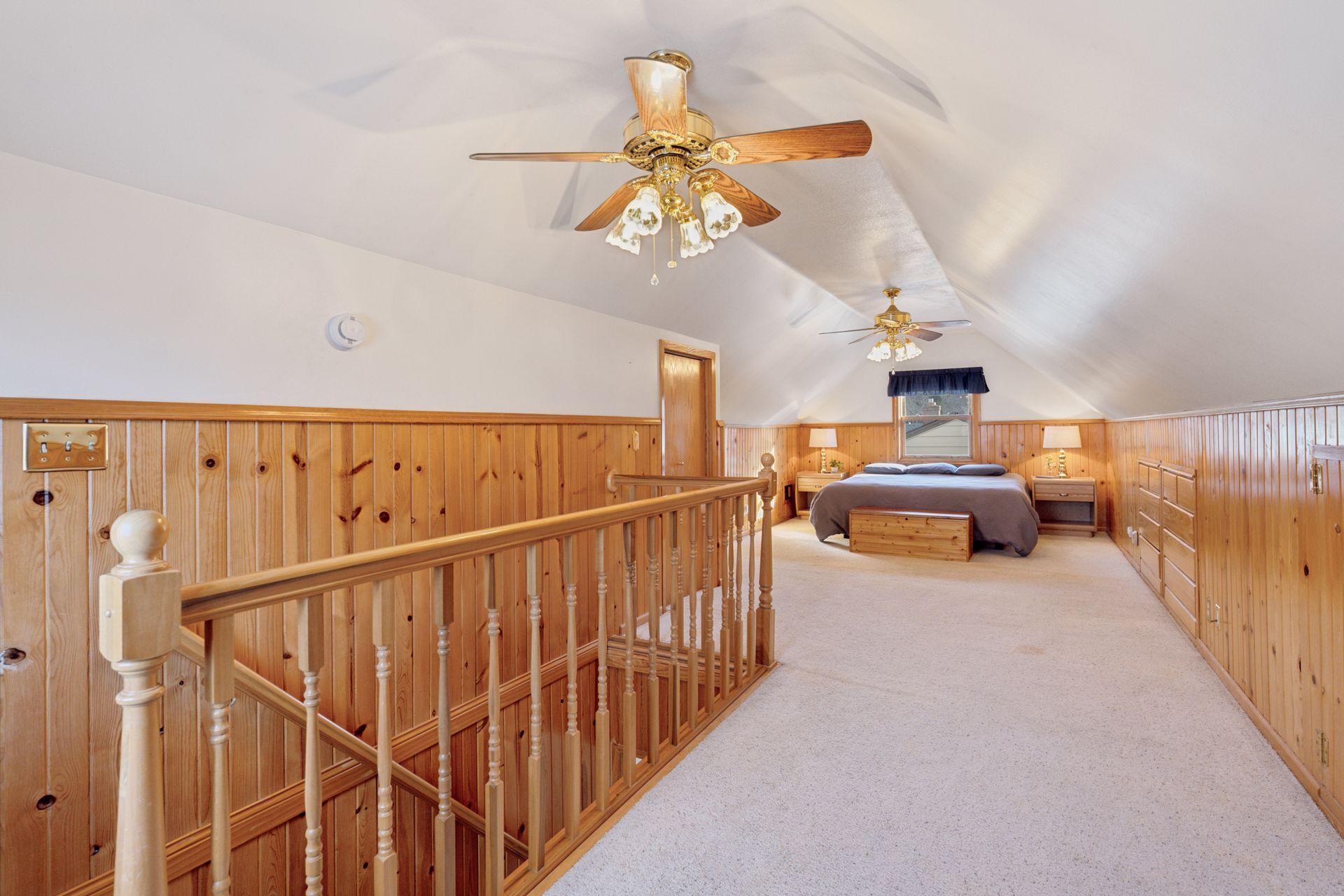 Expansive upper-level bedroom with generous closets, storage and built-ins
