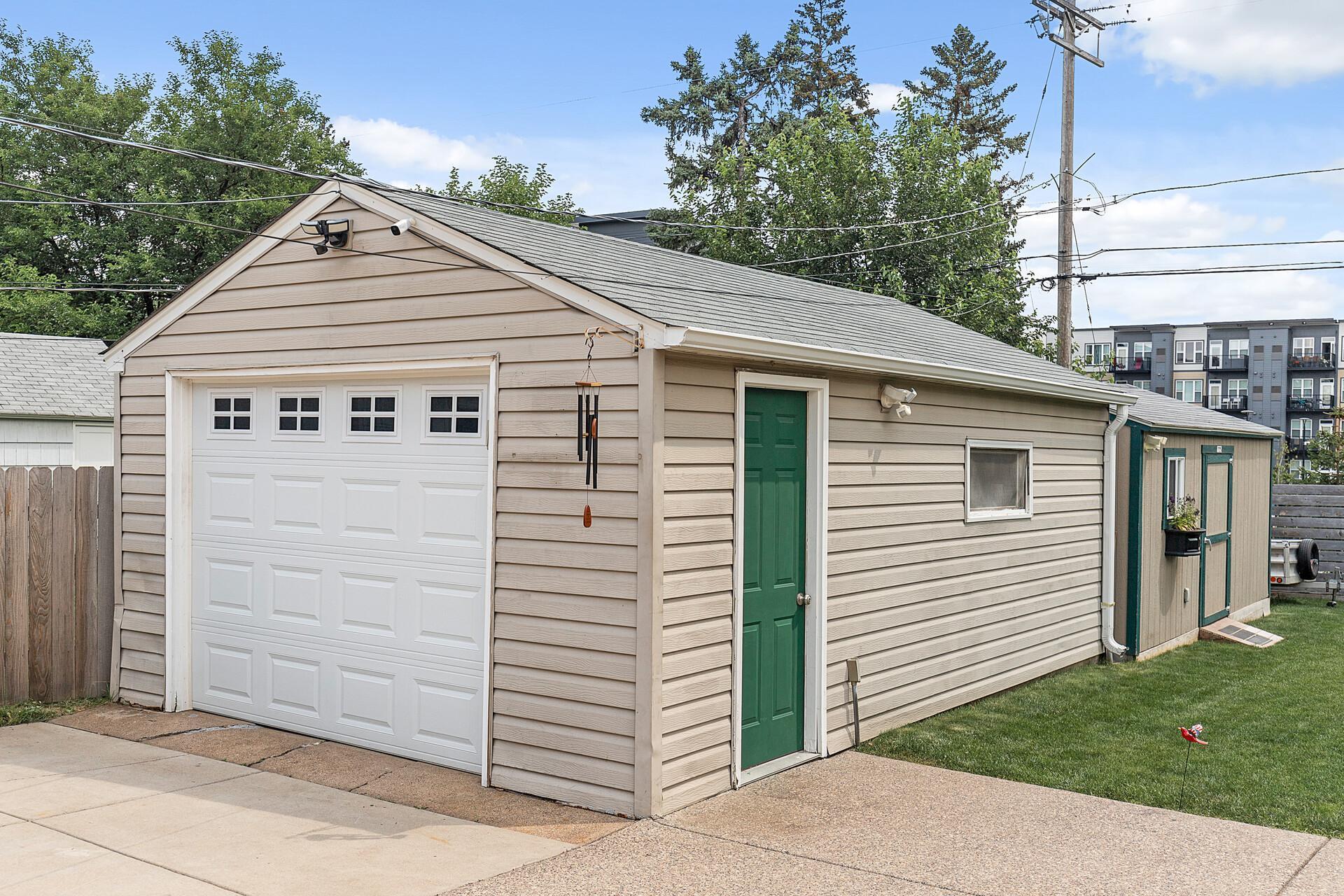 20ft x 12ft Tuff storage shed (located behind the garage) with workshop space