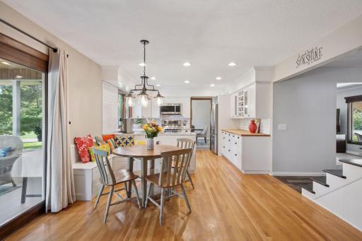 Updated kitchen with stainless steel appliances, an Informal dining area and access to screen porch
