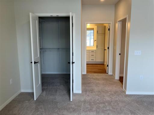 The spacious primary bedroom is a sanctuary of comfort.