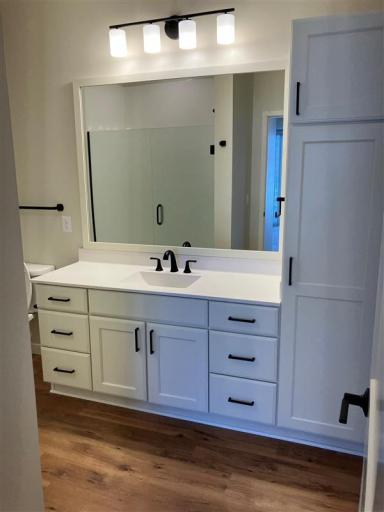 Complete with a private ensuite 3/4 bath featuring quartz countertop and a generous walk-in closet provides ample storage and organization.