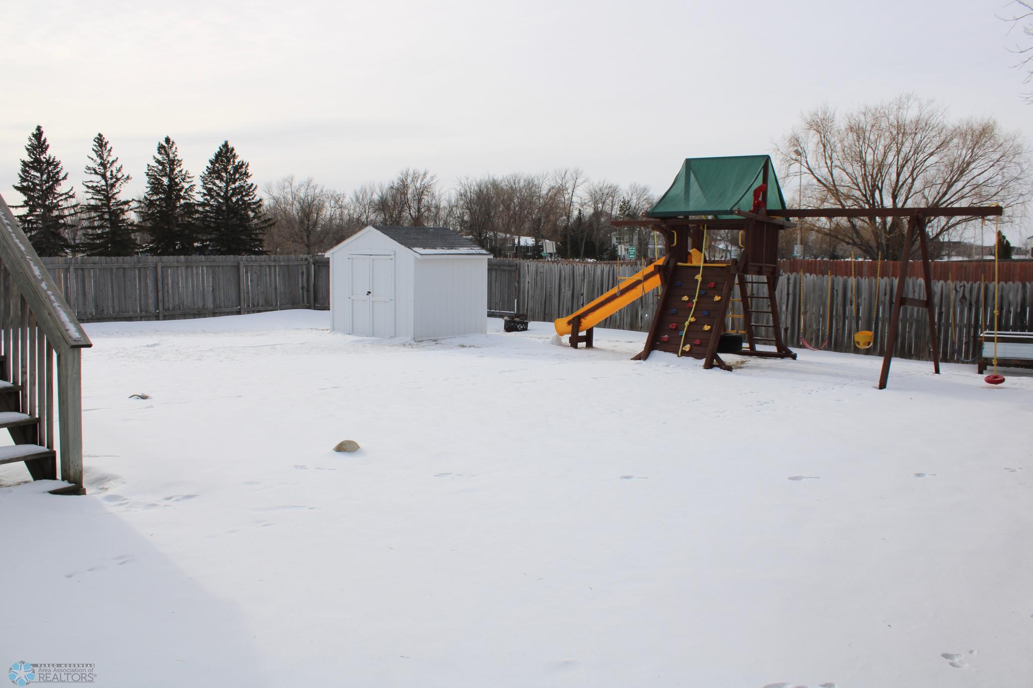 Fully fenced yard, rainbow play system included
