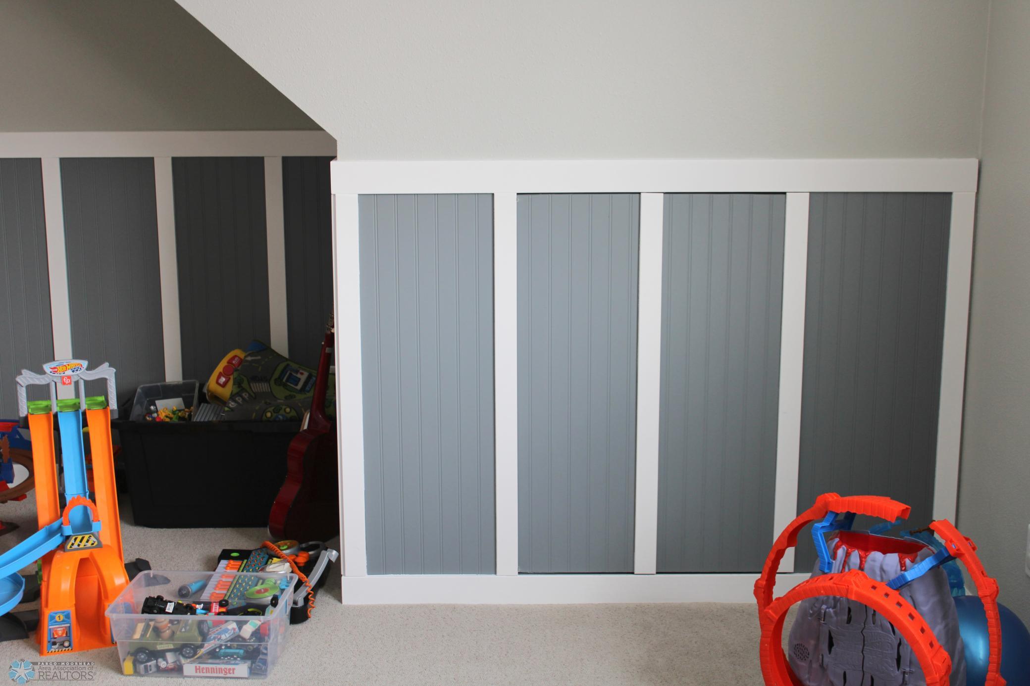Hiding spot under stairs for storage has a door