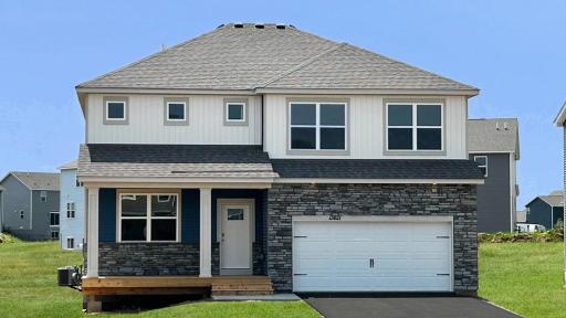Welcome home to the Henry plan in Caramore Crossing! Photo of actual home.