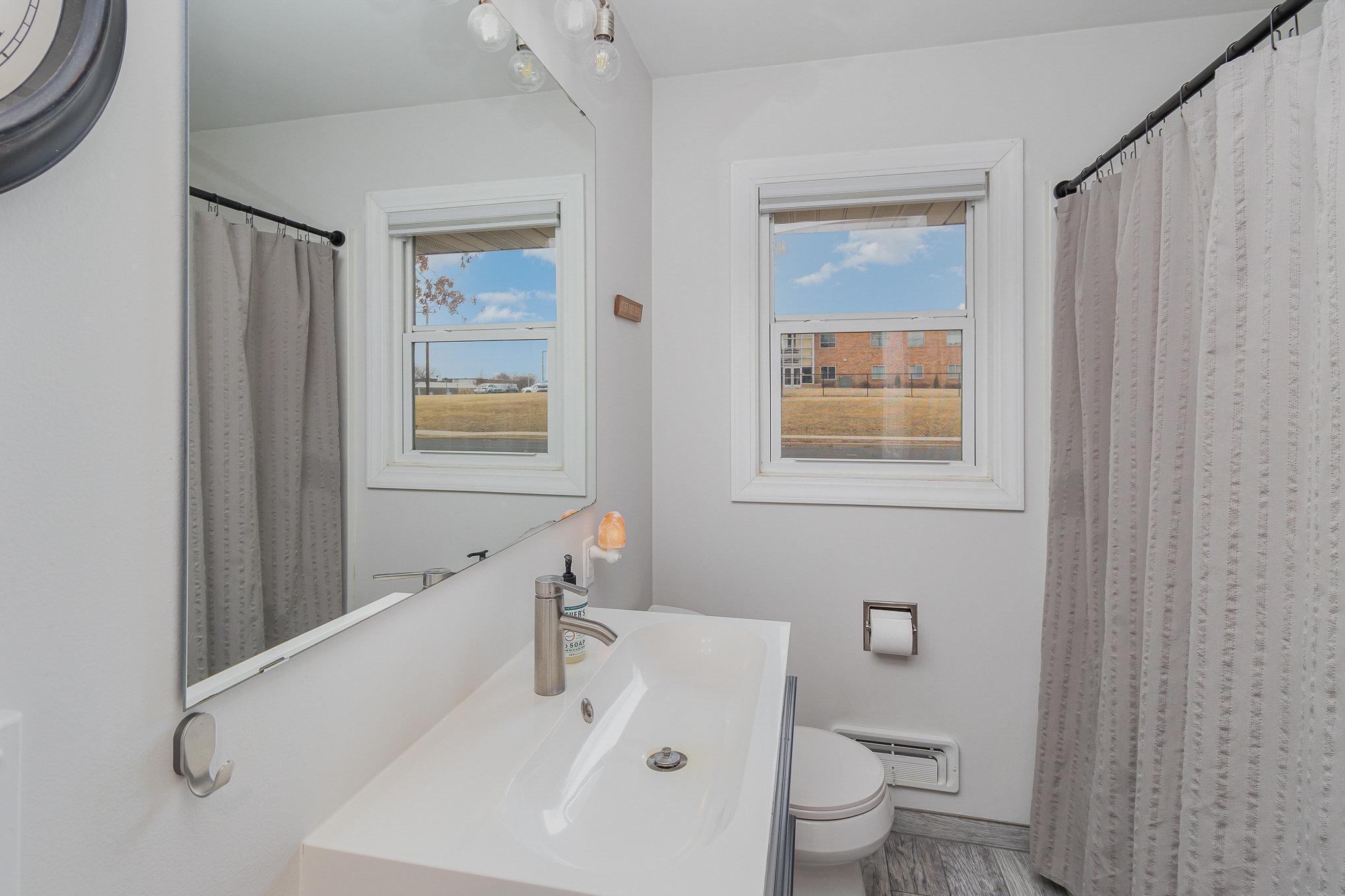 Main bathroom with updated vanity.