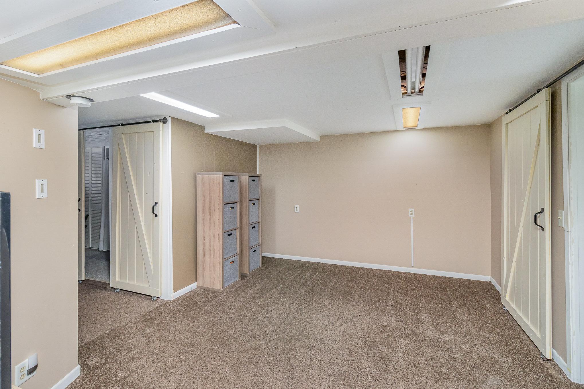 Lower level family room has space for a number of options - gaming area, media room, craft work space?