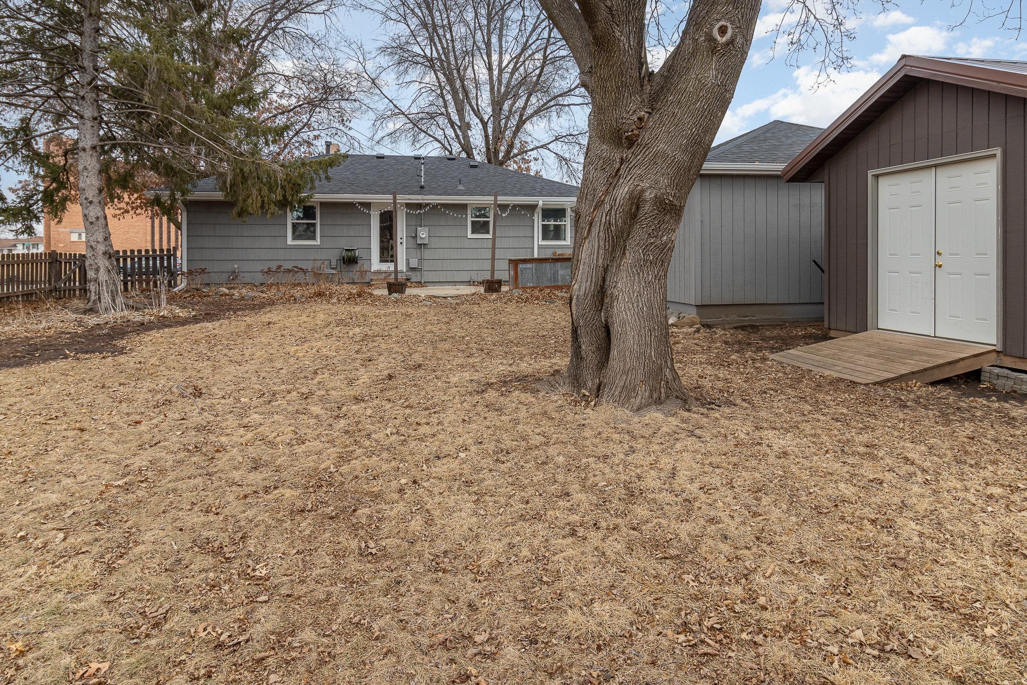 A view back at the house from the back yard. Oodles of space in this completely fenced yard.