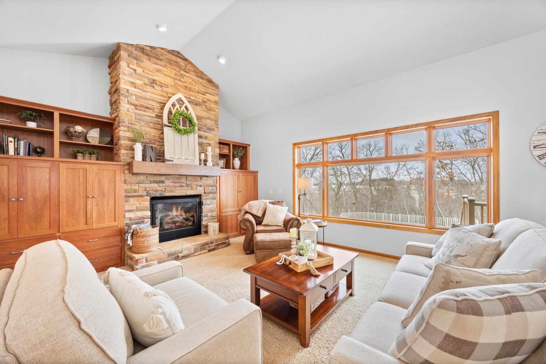 Beautiful Built-ins accenting the Natural Stone Gas Fireplace.jpg