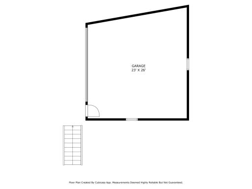 Spacious 2-car garage with a large driveway for additional parking.