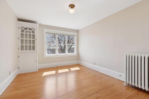 Third bedroom on second floor. Built-in cabinetry. Southeastern exposure.