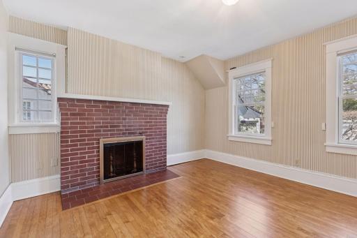 Second floor den with wood-burning fireplace. Optional second floor 4th bedroom. Northwestern exposure.