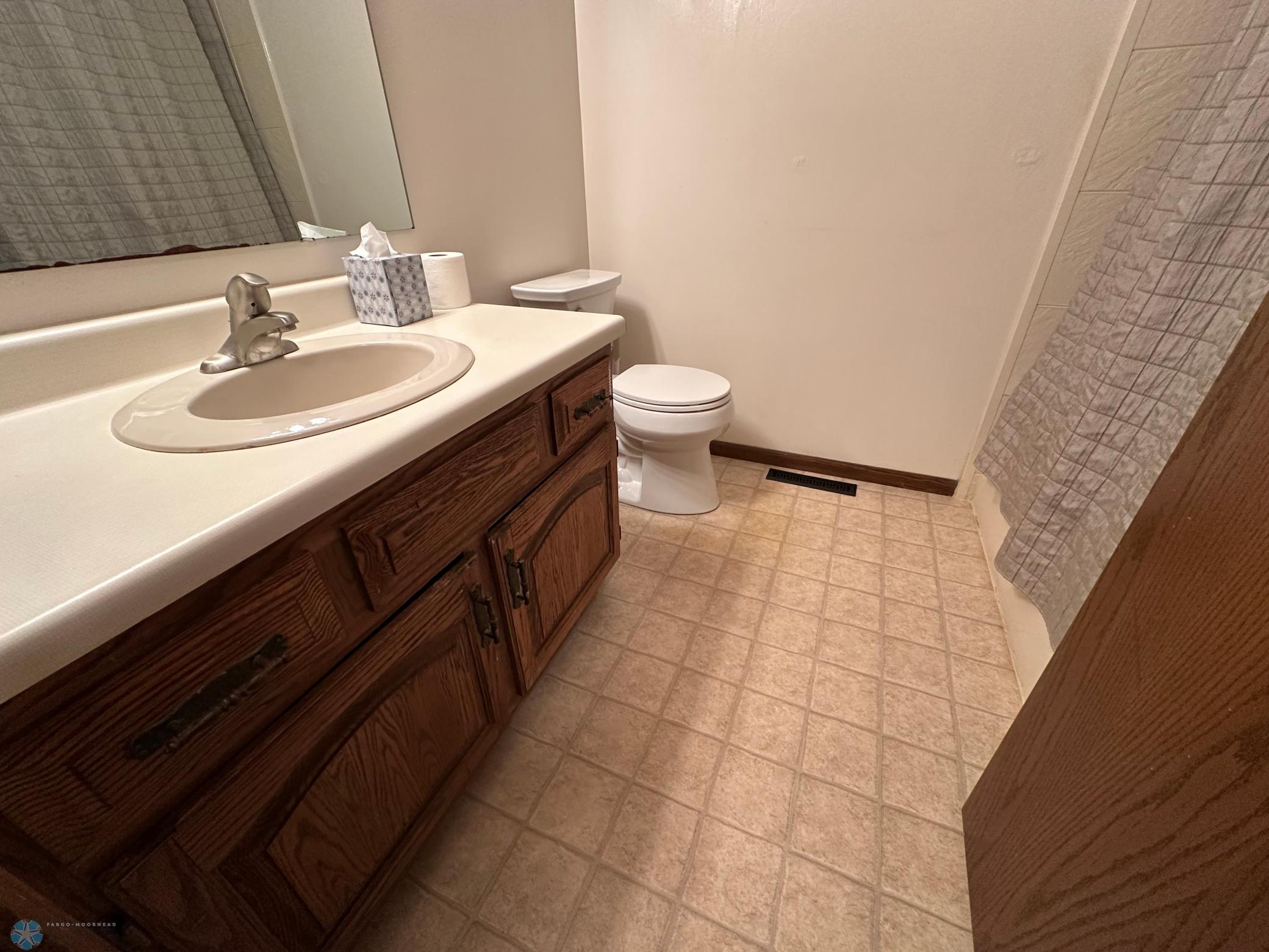 Full bath has newer tub surround rom bath fitter
