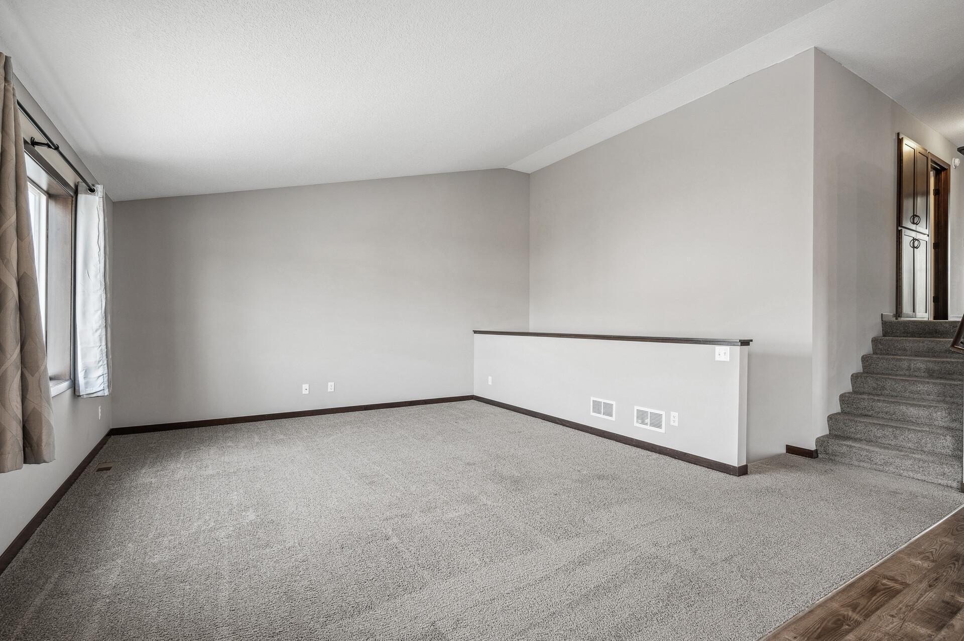 Open concept living room with vaulted ceiling