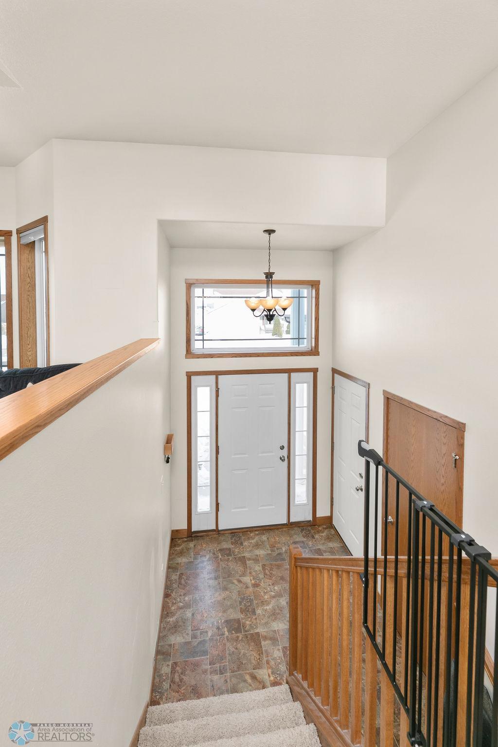 Foyer w/ coat closet + garage access