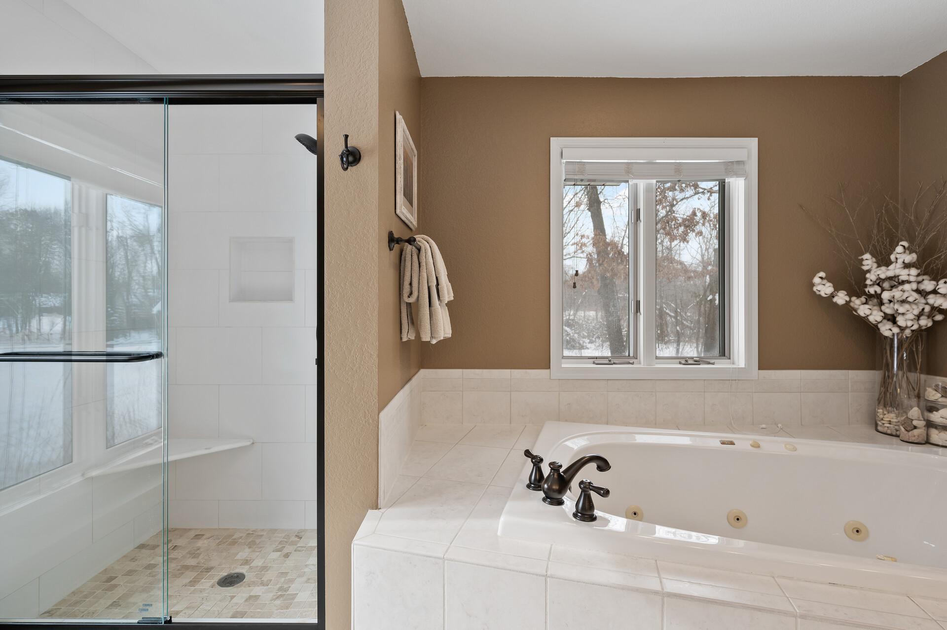 Jetted tub, updated shower, tile flooring
