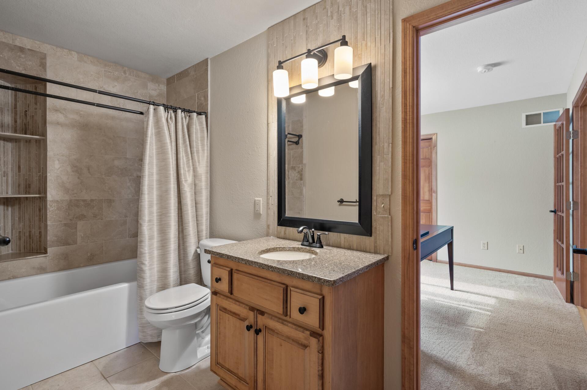Roomy updated main-level full bathroom.