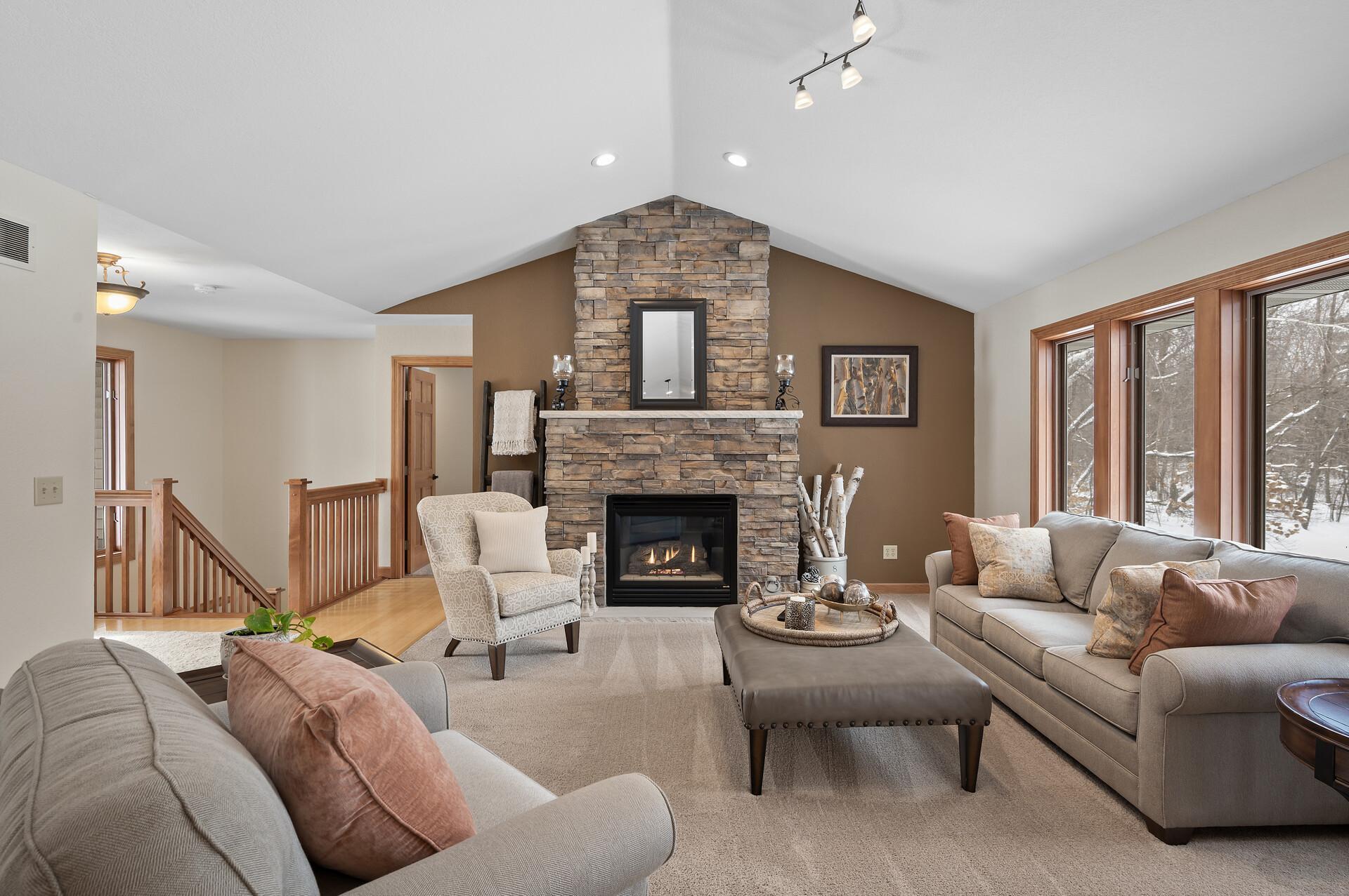 Gas fireplace with floor to ceiling rock surround