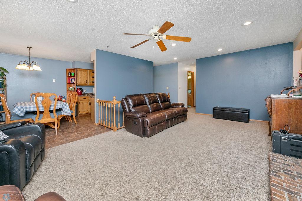 Living Room with ceiling fan & recessed lighting