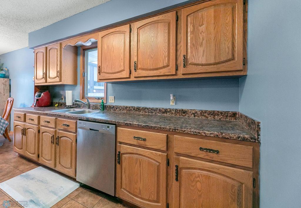 Stainless appliances. Natural oak cabinets.
