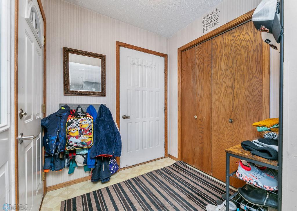 Foyer with storage space & coat closet