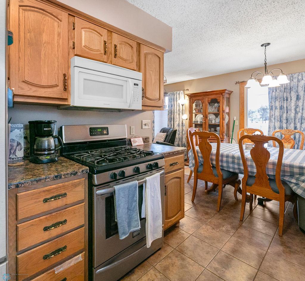 Kitchen Gas stove, adjacent Dining area