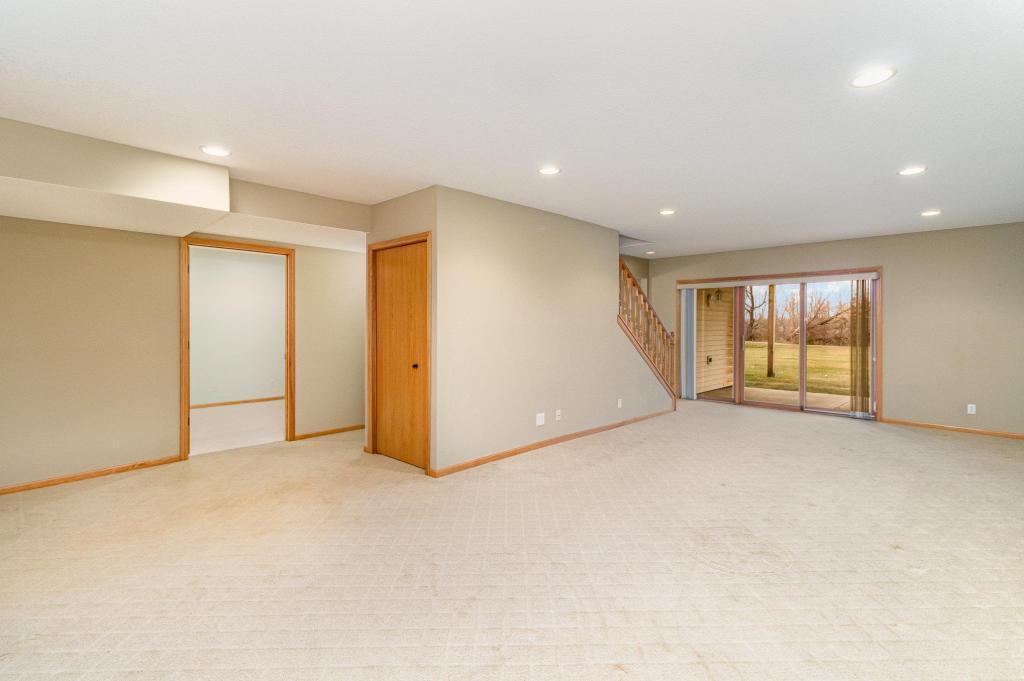 652 Aqua Cir small.jpg Lower level family room with walk out to patio.jpg