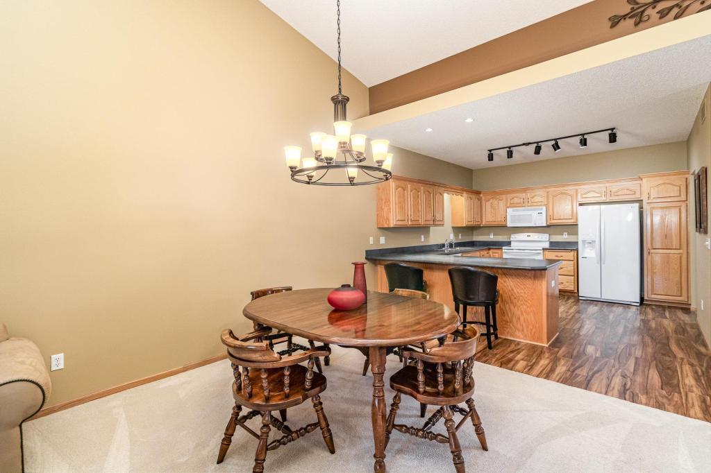 652 Aqua Cir small.jpg Dining area and kitchen with counter height seating.jpg