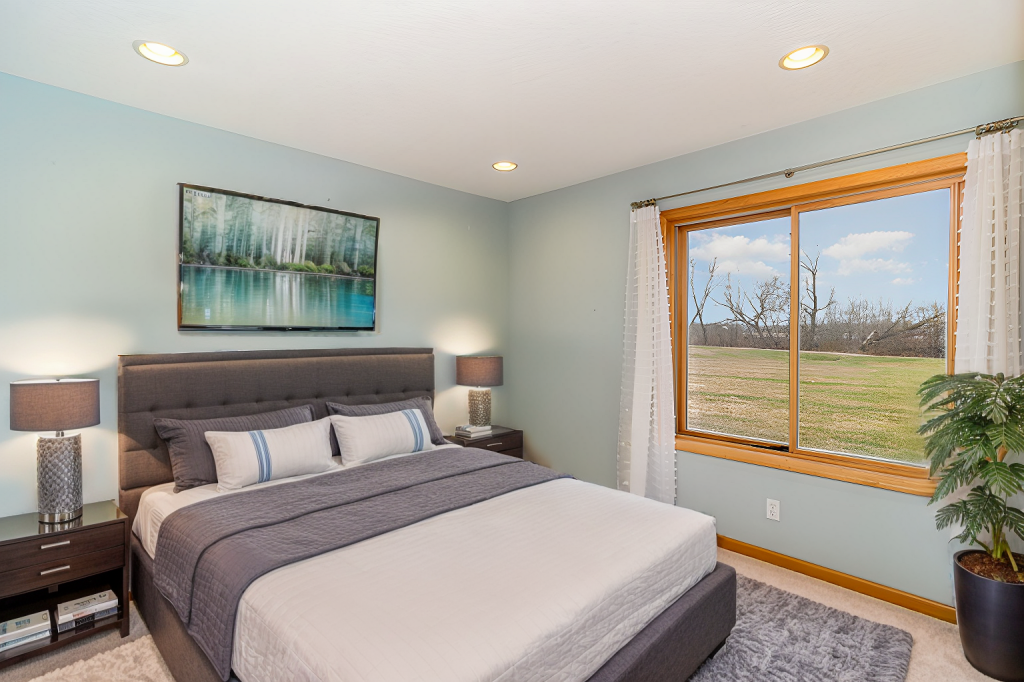 652 Aqua Cir small.jpg Lower level bedroom virtually staged.jpg