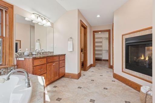 Primary Bathroom Suite with in floor heat, private commode and spacious walk-in closet.