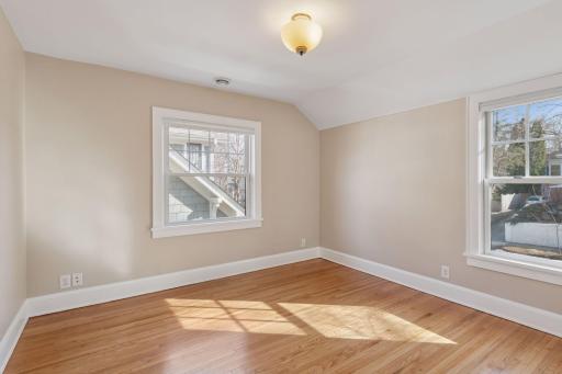 Third upper level bedroom. Fresh paint, refinished oak floors and newer windows! Blinds on all windows.