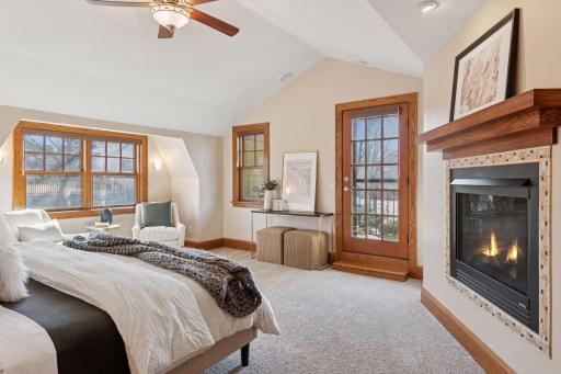 Spacious Primary Bedroom Suite with 2 sided fireplace, vaulted ceilings and private balcony.