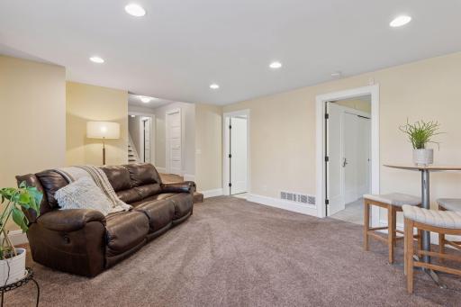 Walk-out Lower Level Family Room - Recessed lighting, fresh paint and carpeted flooring. Light and Bright!