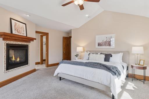 Primary Bedroom Suite - Spacious yet cozy with the two-sided fireplace.