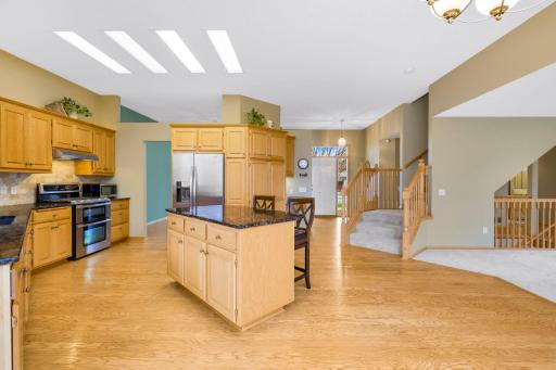 Stainless steel appliances include gas range w/ dual ovens, decorative hood, dishwasher and refrigerator