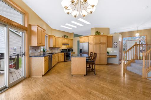 Abundance of oak cabinetry feature raised panel doors and accent lighting above the uppers