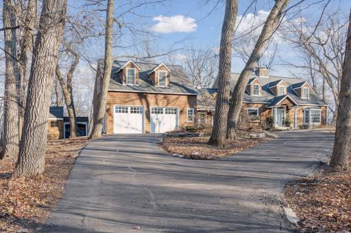 Welcome home to 4501 Eastwood Road. Nestled on a lovely, wooded lot with convenient circle driveway.